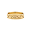 Gold ring with intricate design on a white background