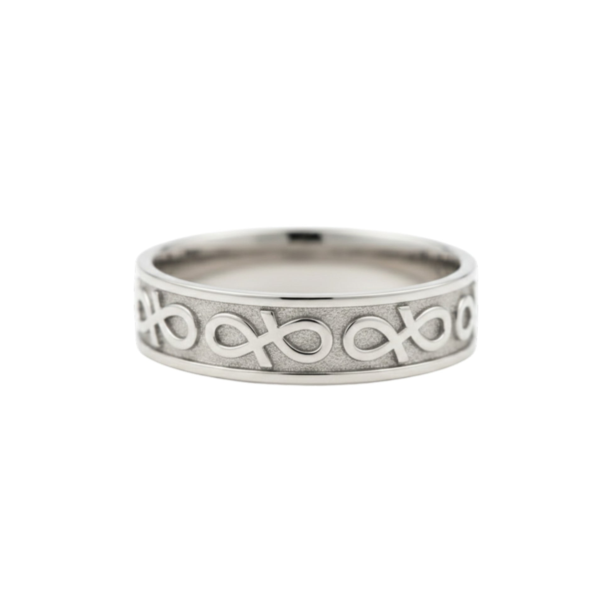 Silver ring with intricate design on a white background