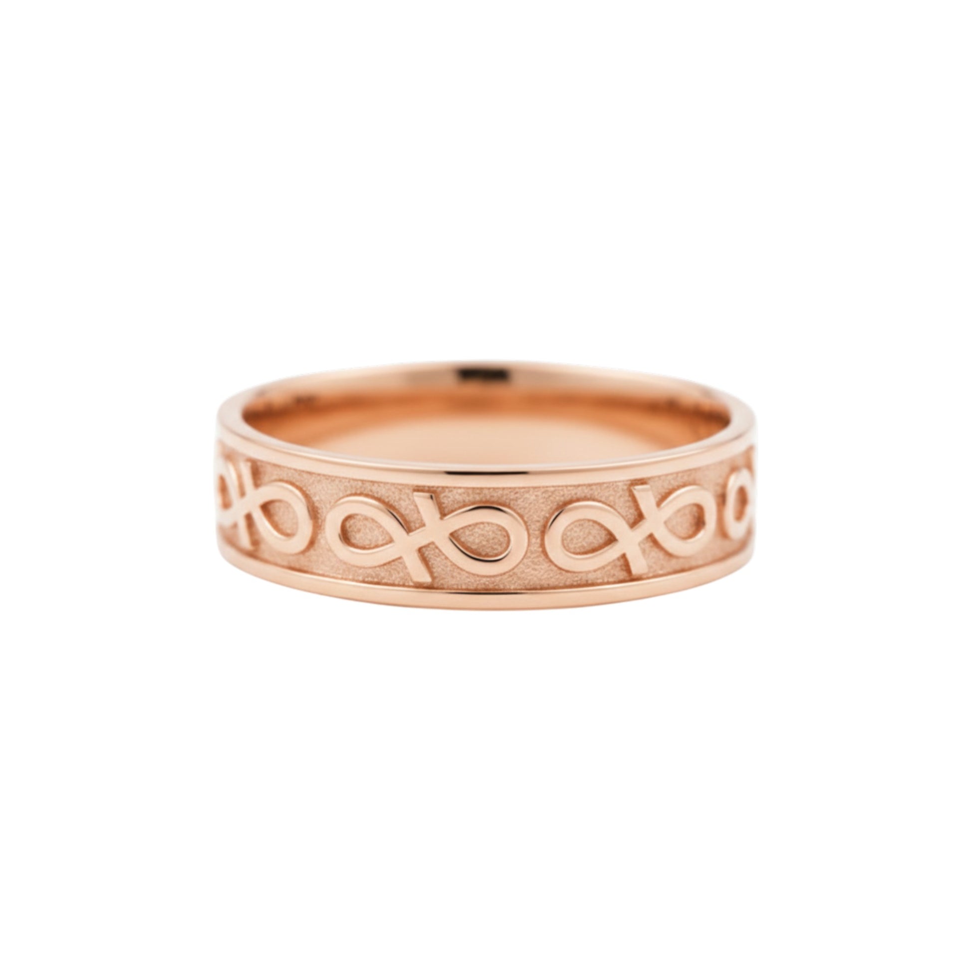 Rose gold ring with intricate design on a white background