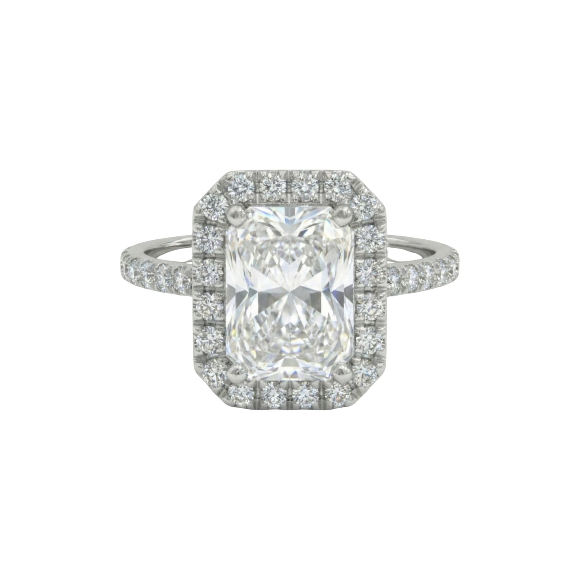 Diamond ring with a central gemstone and smaller diamonds on a white background