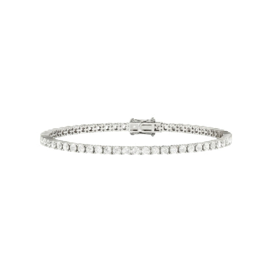 Silver bracelet with clear stones on a white background