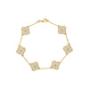 Gold bracelet with floral designs on a white background