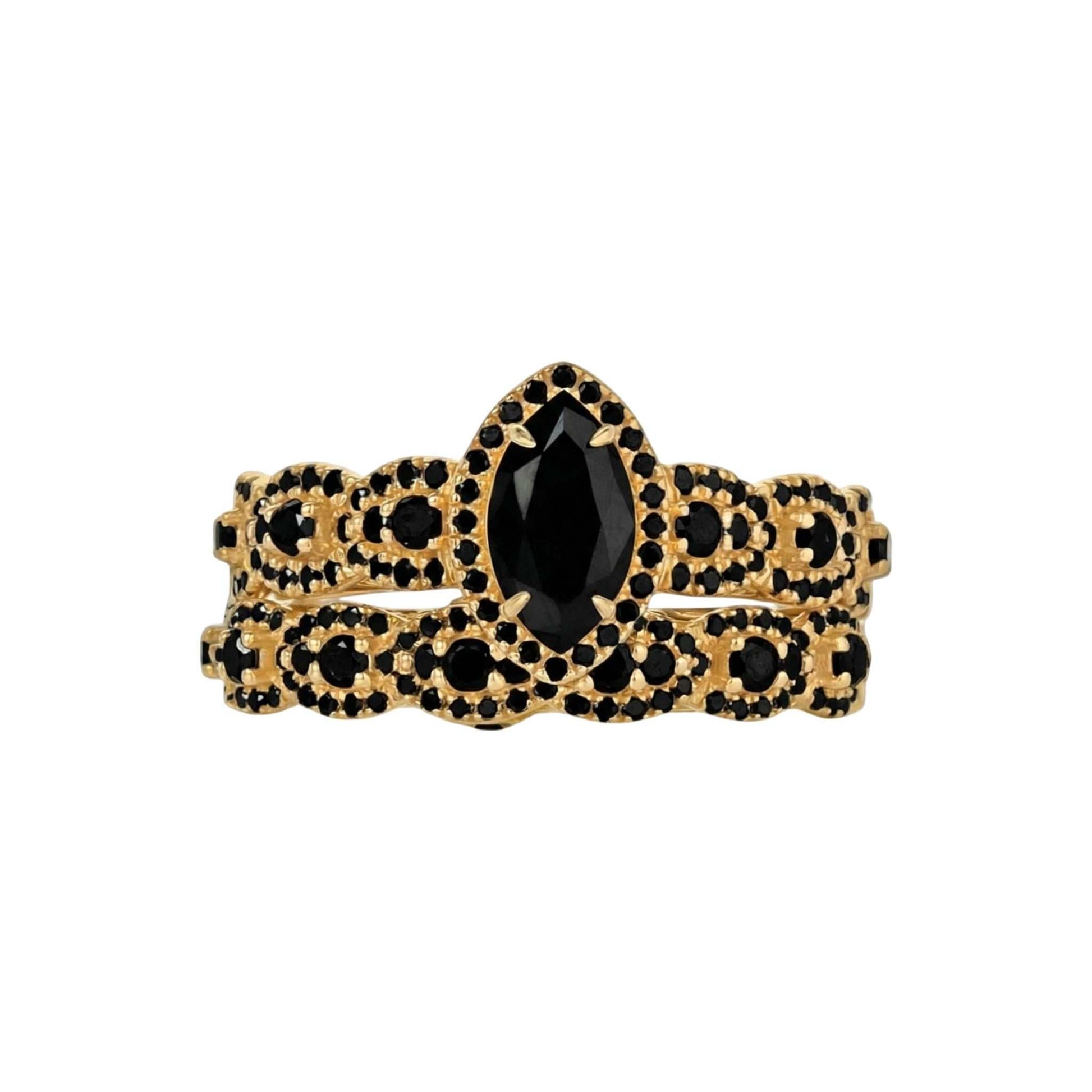 Gold bracelet with black gemstones on a white background
