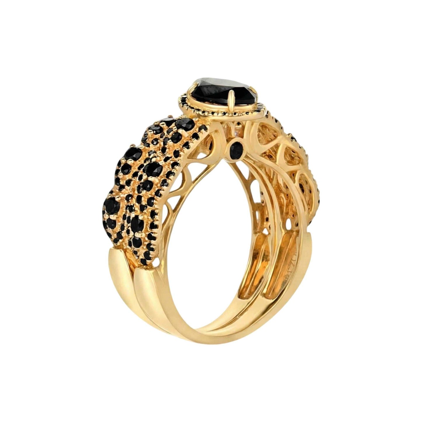 Gold ring with black gemstones on a white background