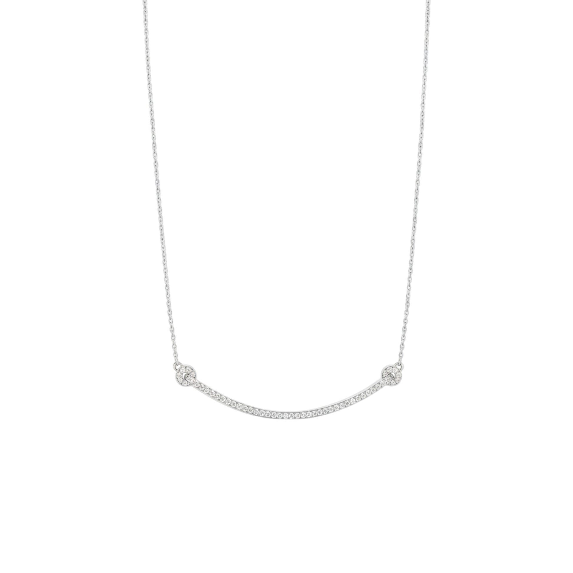 Silver necklace with small round pendants on a white background