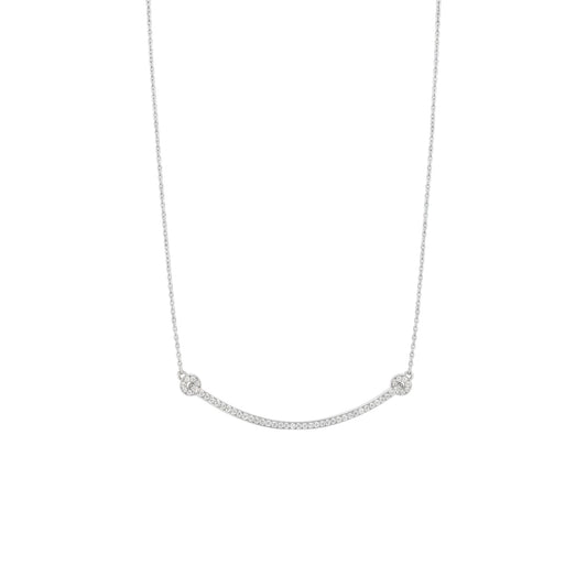 Silver necklace with small round pendants on a white background