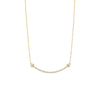 Gold necklace with small beads on a white background