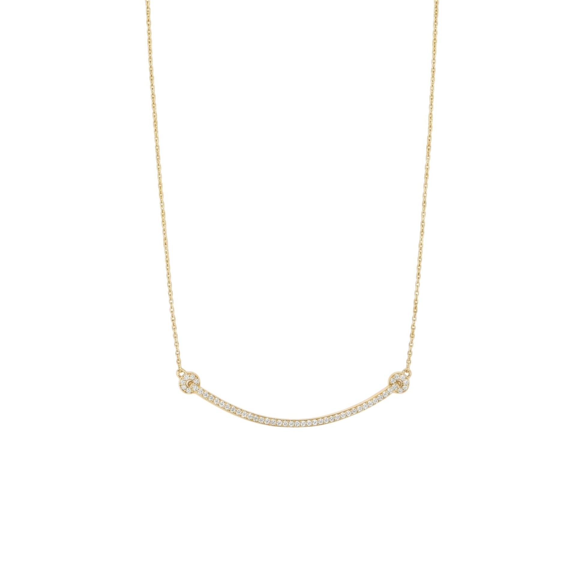 Gold necklace with small beads on a white background