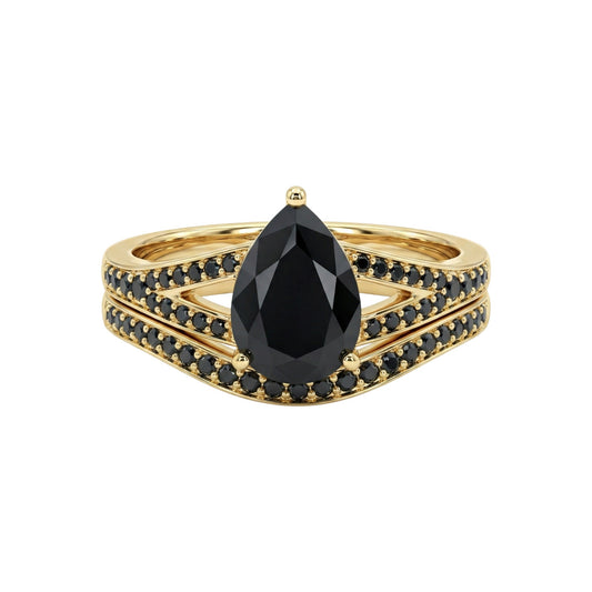 Gold ring with a large black gemstone on a white background