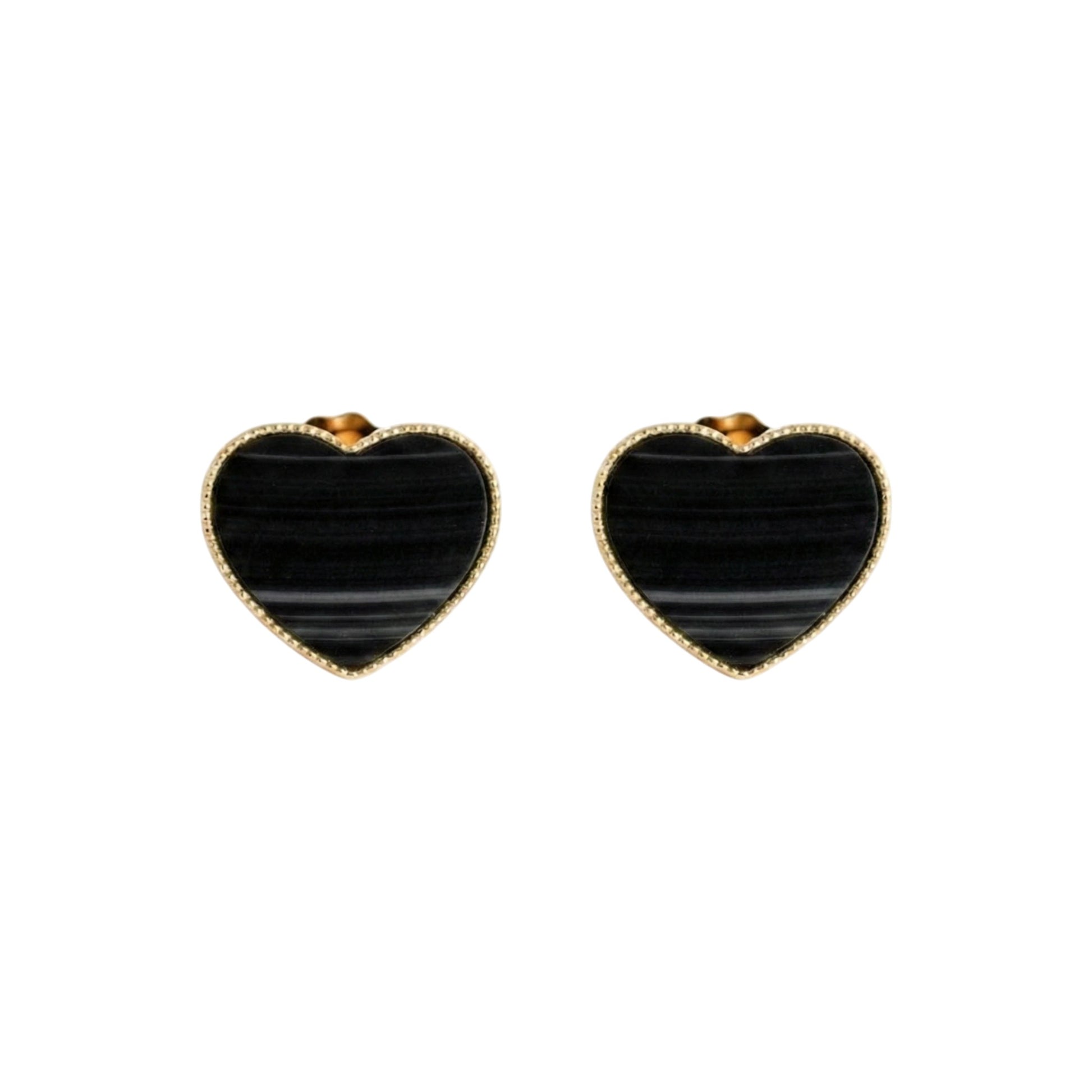 Heart-shaped black stone earrings with gold accents on a white background