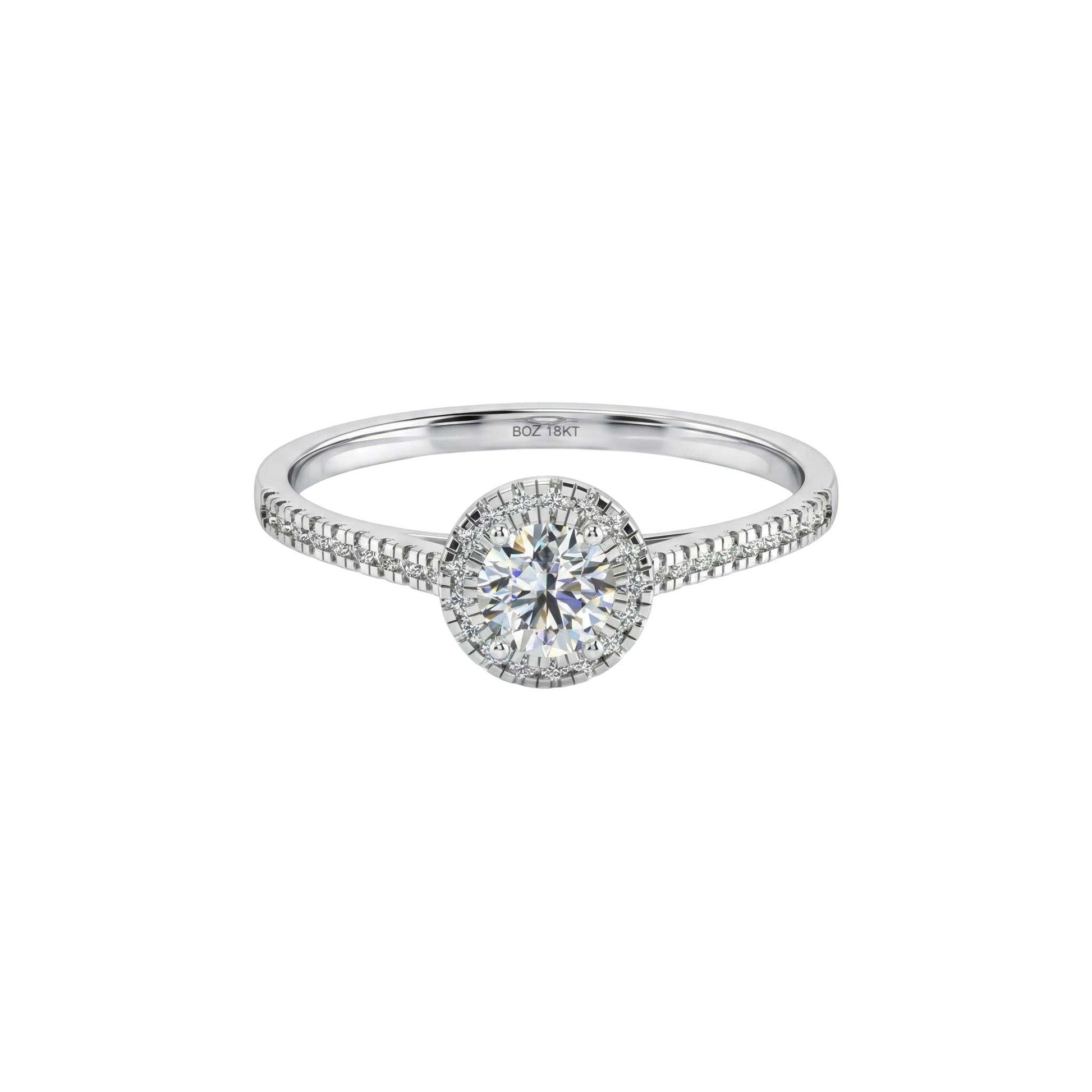 Thelma Round Cut Natural Diamond engagement ring in 18KT gold with pavé diamond halo and slim diamond-accented band