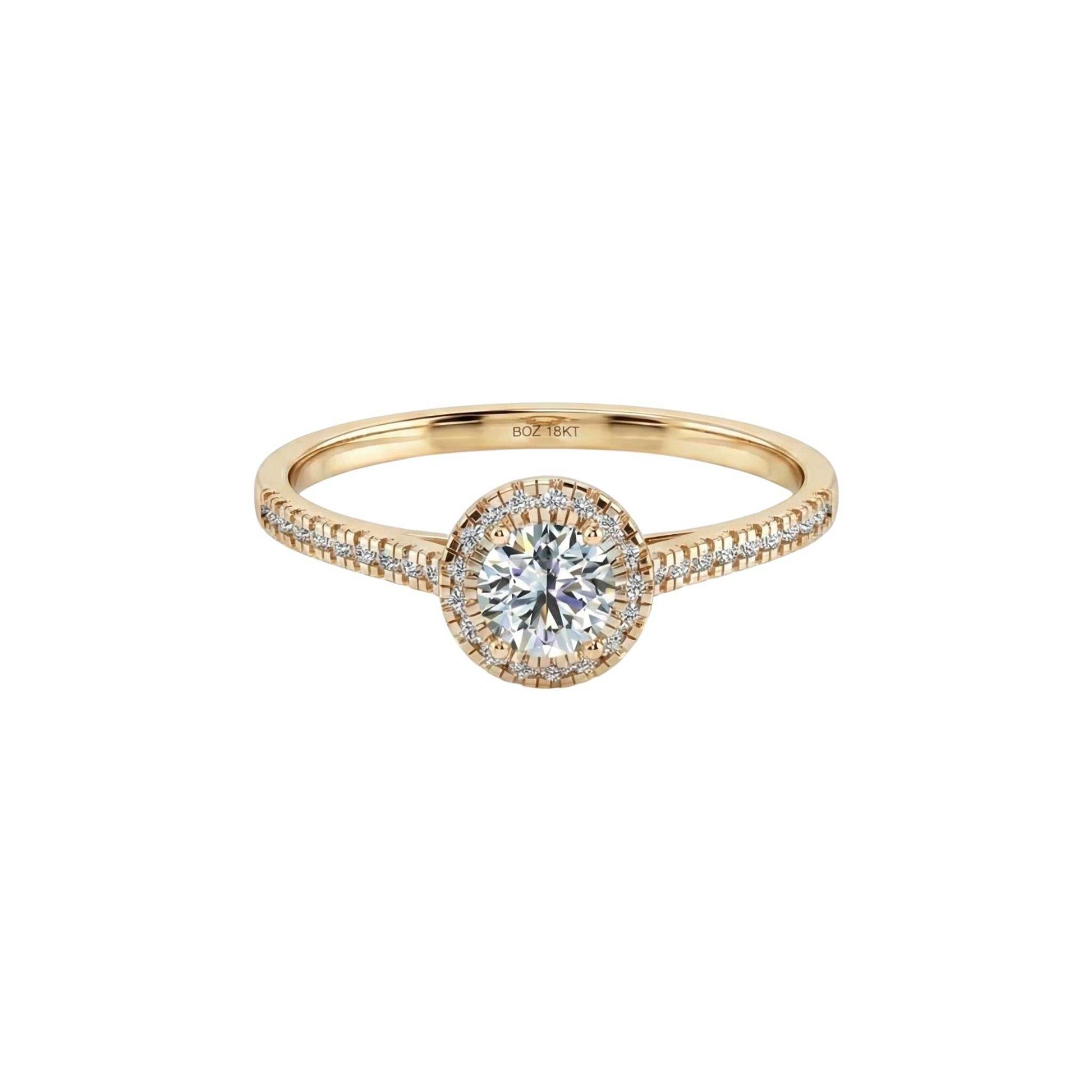 Gold ring with a diamond on a white background