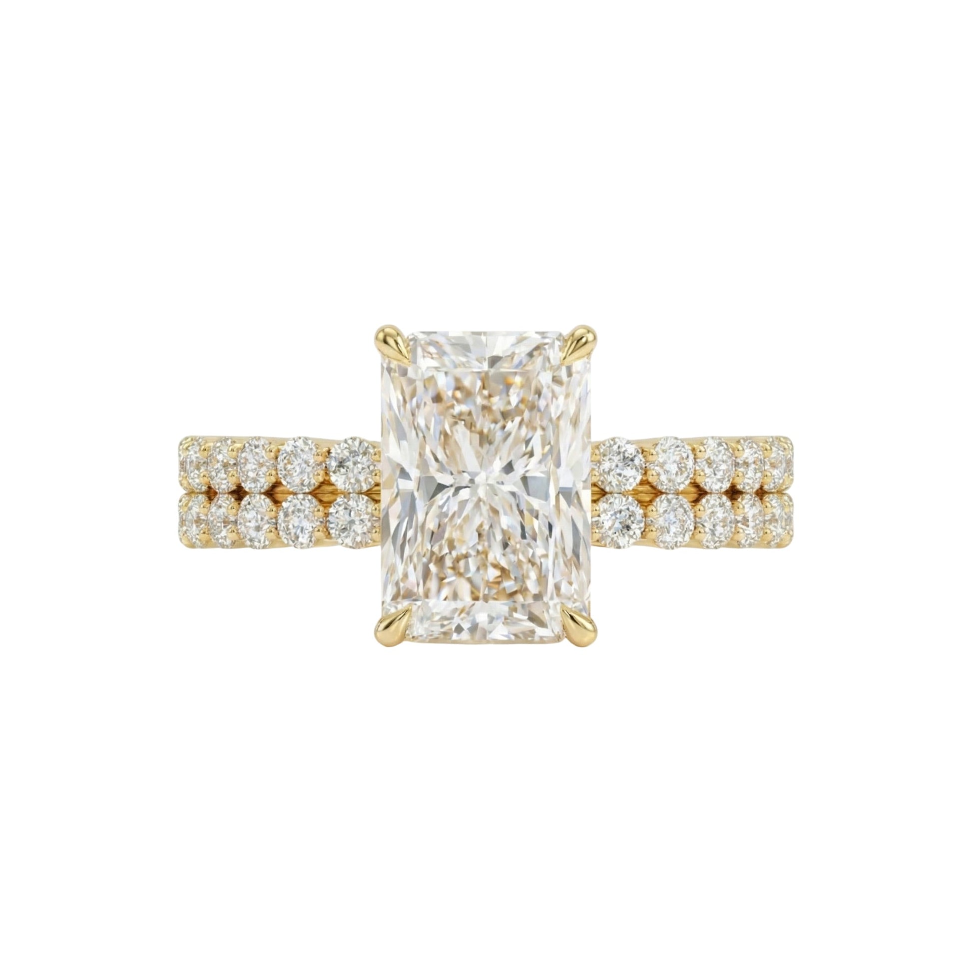 Gold ring with a large diamond and smaller diamonds on the band against a white background
