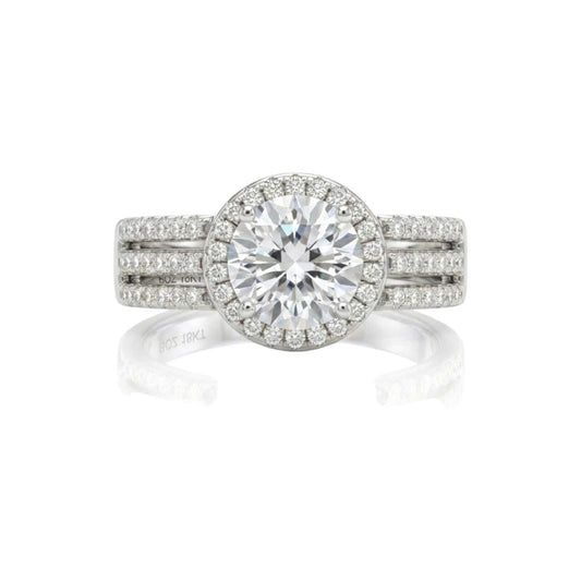 Triple shank sterling silver engagement ring with round cut cubic zirconia and double halo pavé design