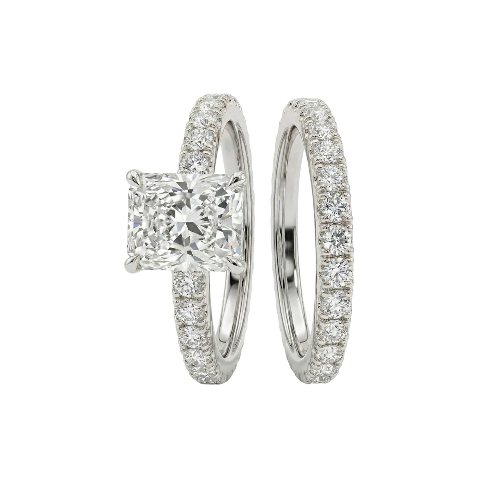 Diamond ring with a square-cut center stone on a white background