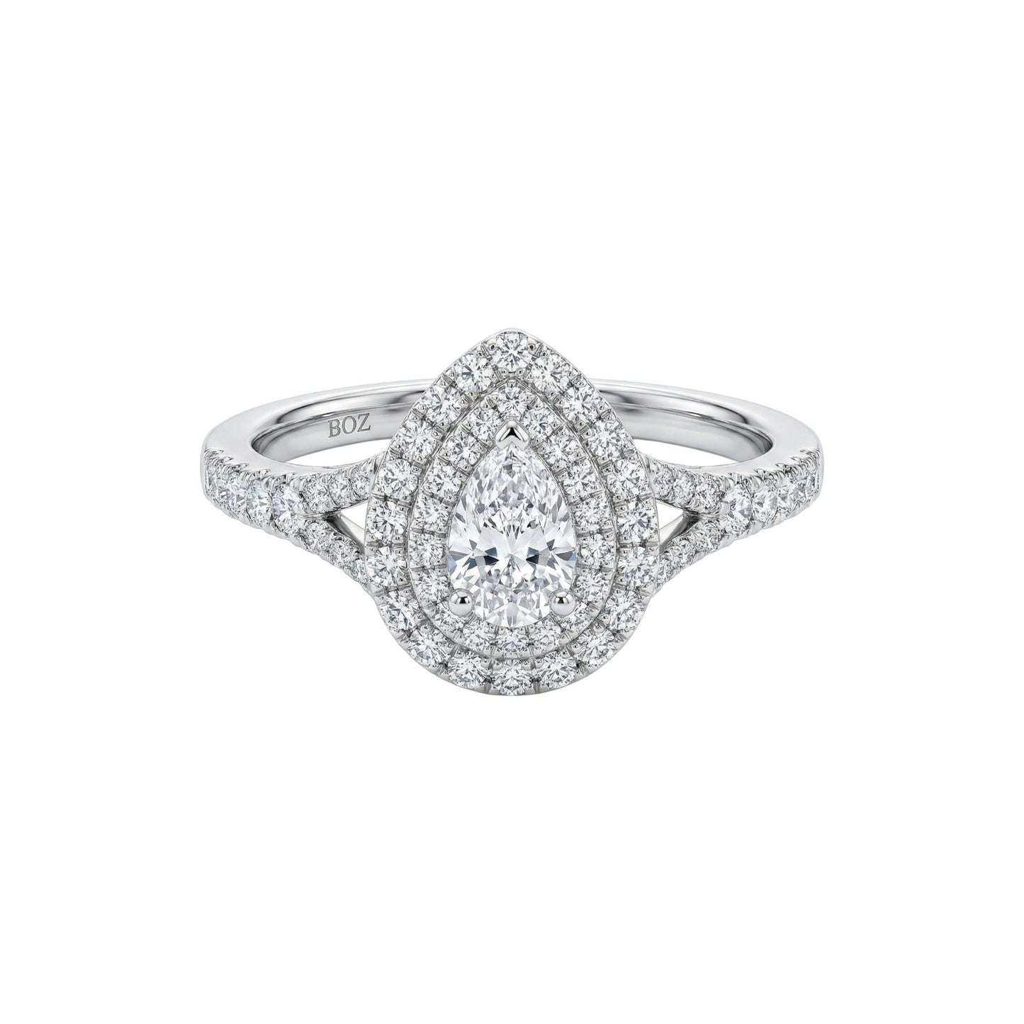 Diamond ring with a pear-shaped center stone on a white background