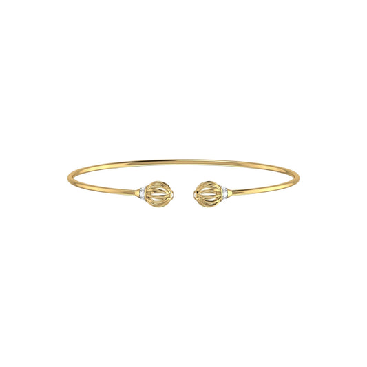 Gold bracelet with two decorative elements on a white background