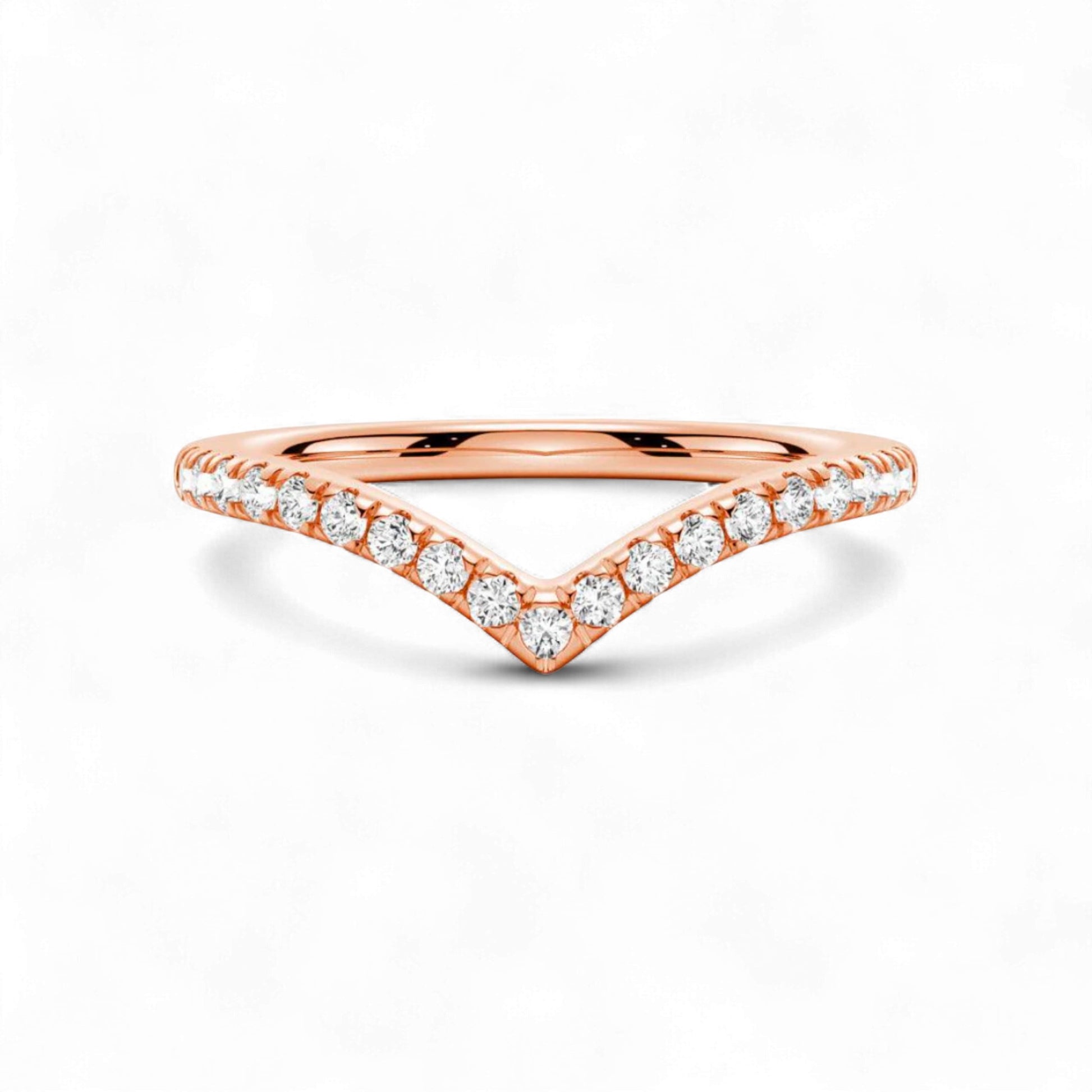 Rose gold ring with diamond accents on a white background