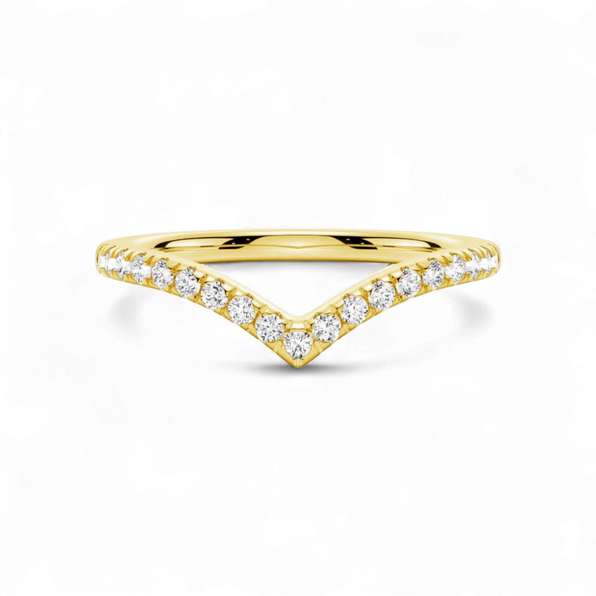 Gold ring with diamond accents on a white background