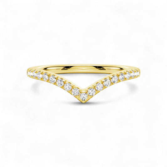Gold ring with diamond accents on a white background
