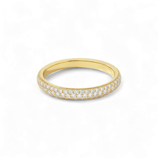 Gold ring with embedded diamonds on a white background