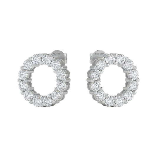 Pair of silver hoop earrings with clear gemstones on a white background