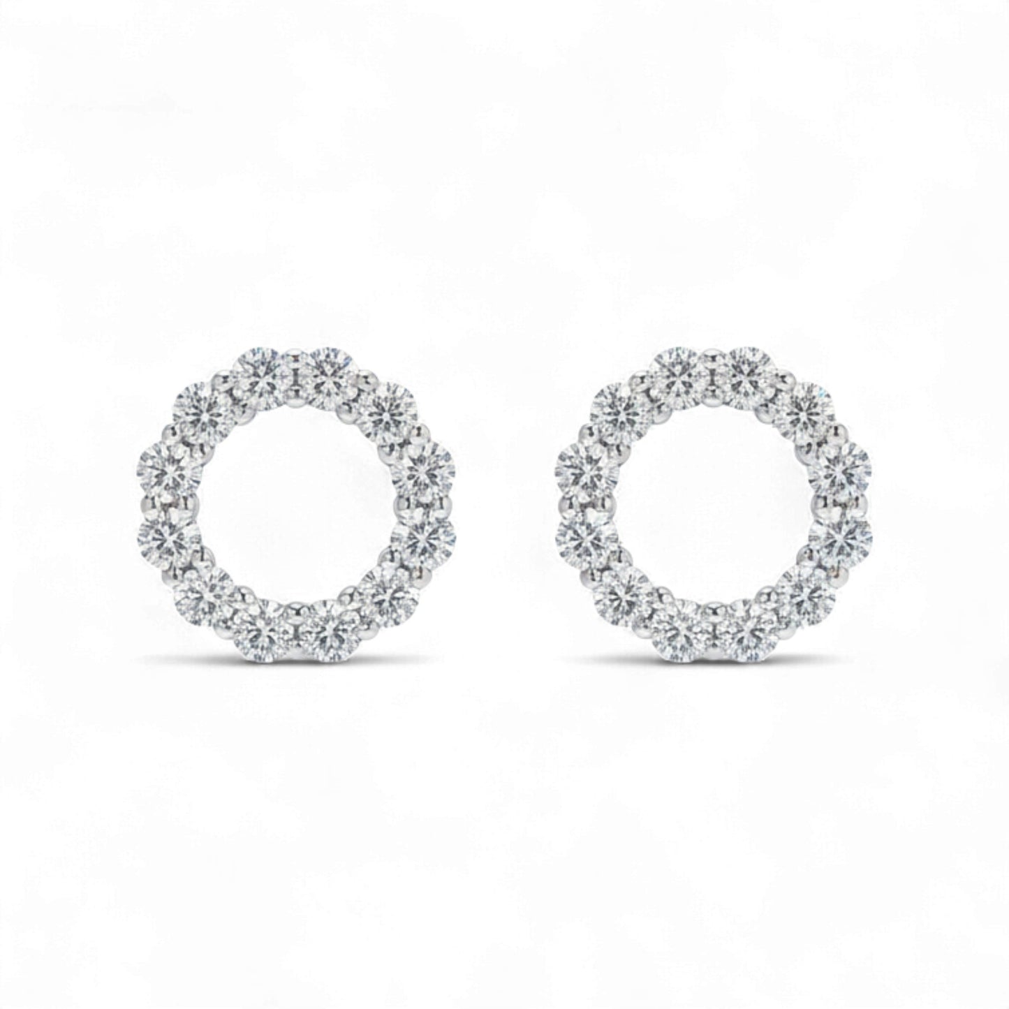 Pair of diamond earrings on a white background