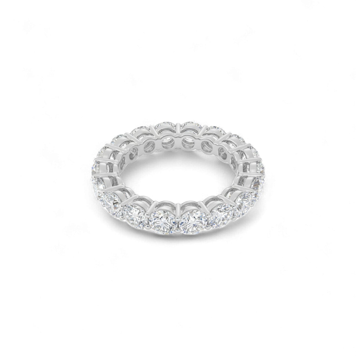 Silver ring with diamond accents on a white background