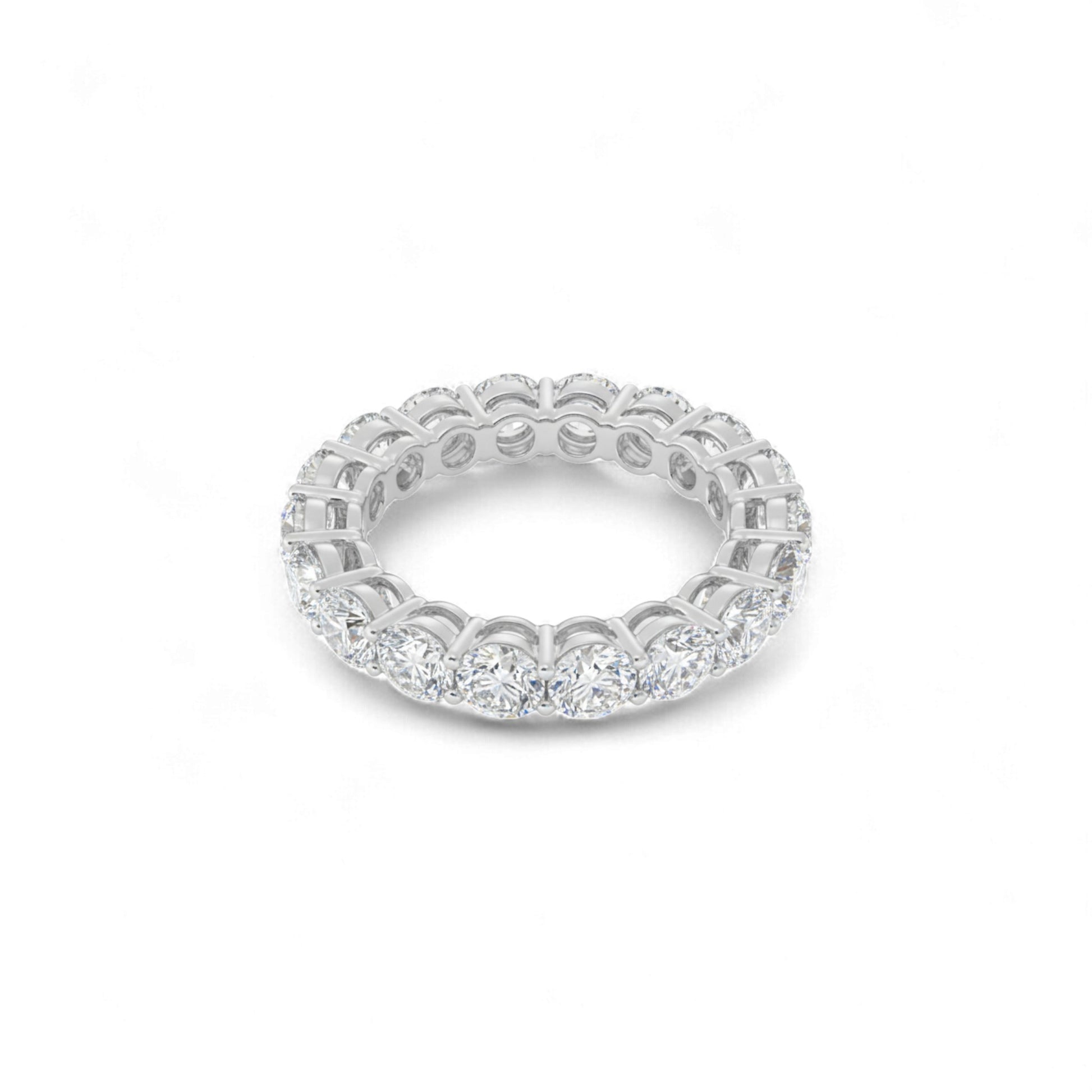 Silver ring with diamond accents on a white background