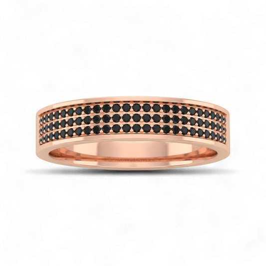 Rose gold ring with black gemstones on a white background