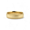Gold ring with textured design on a white background