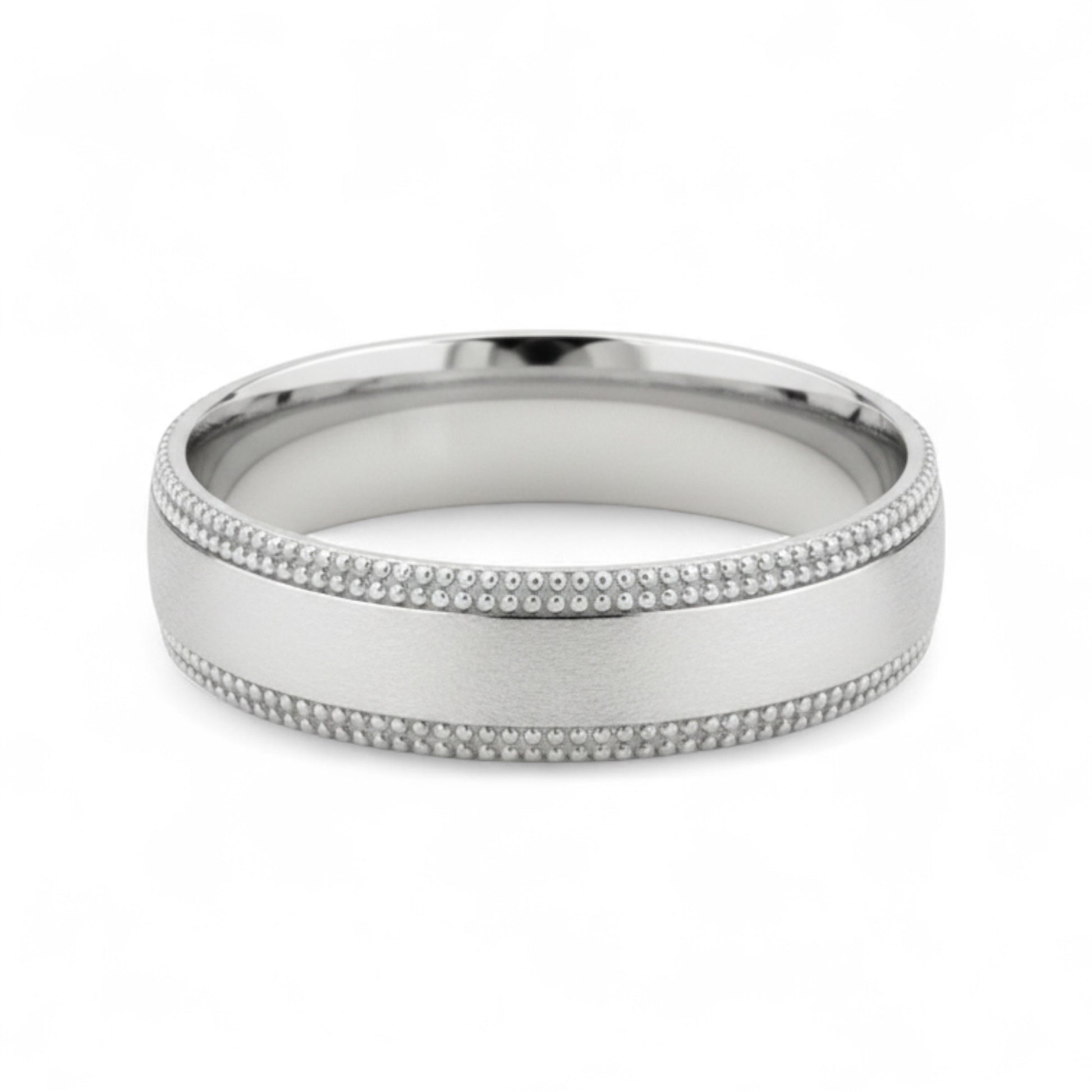 Silver ring with milgrain detailing on a white background