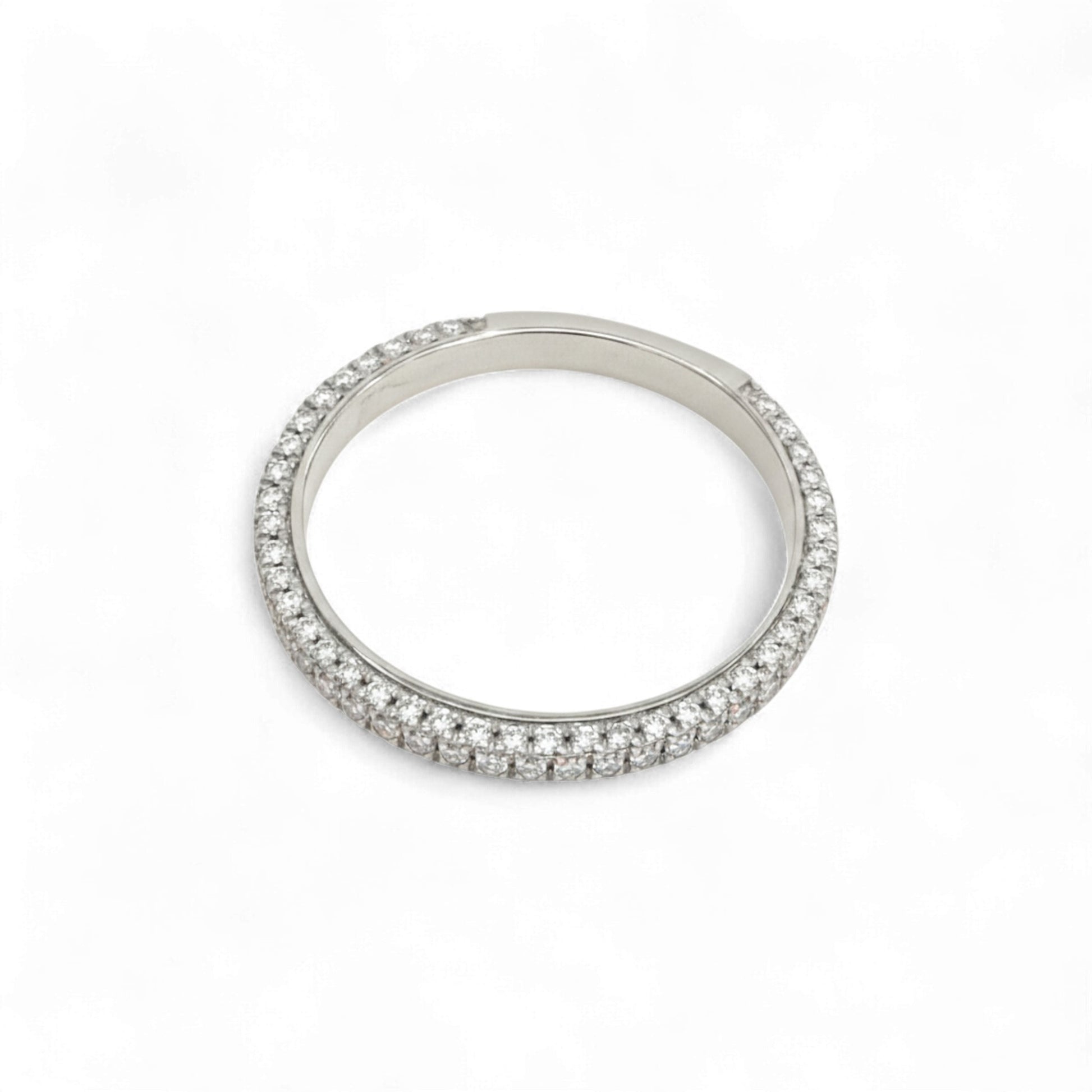Silver ring with small stones on a white background