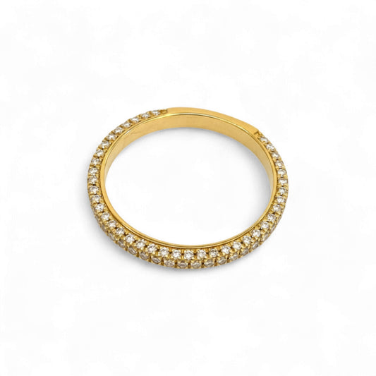 Gold ring with embedded diamonds on a white background