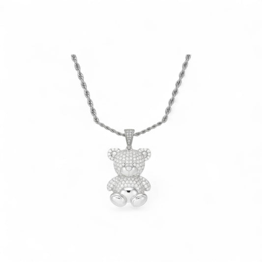 Silver teddy bear pendant necklace on a white background