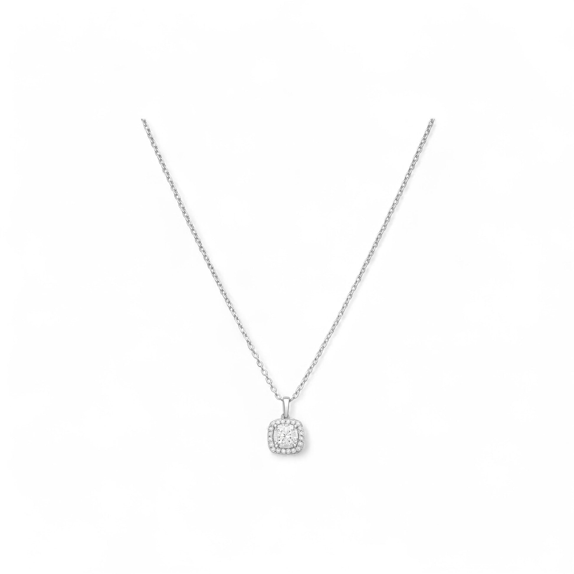 Silver necklace with a round pendant on a white background