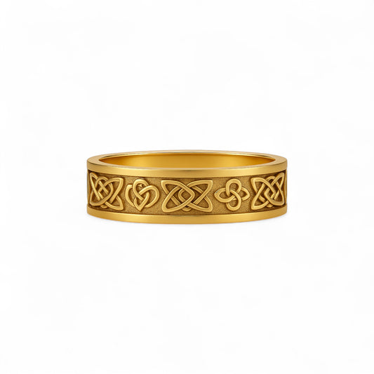 Gold ring with Celtic knot design on a white background