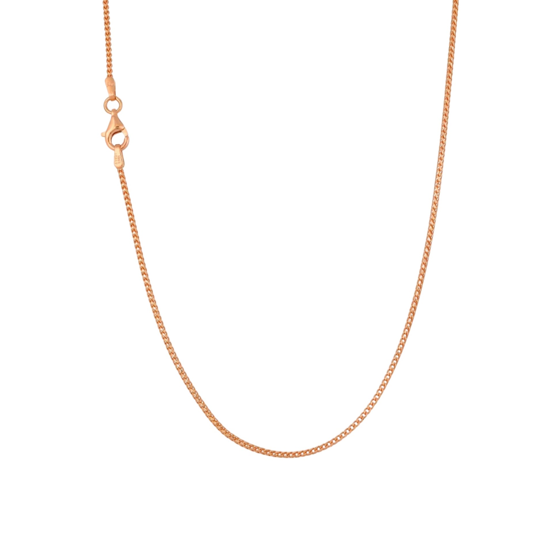 Rose gold chain necklace on a white background