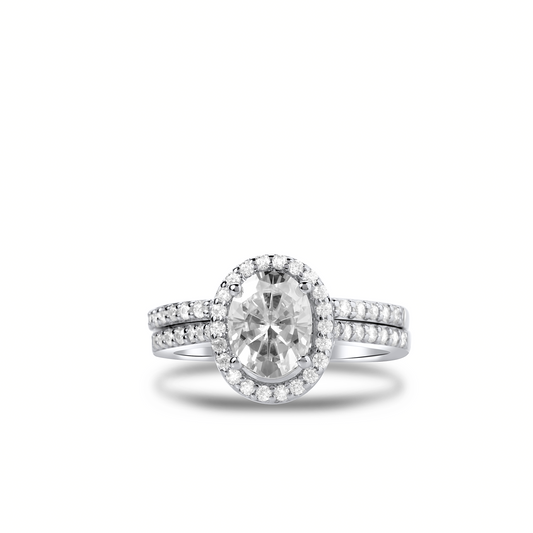 Diamond ring with a large central gemstone and smaller stones on a white background