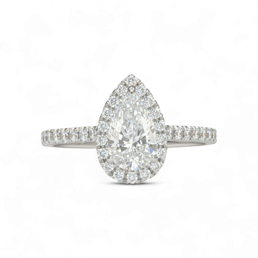 Diamond ring with pear-shaped center stone on a white background