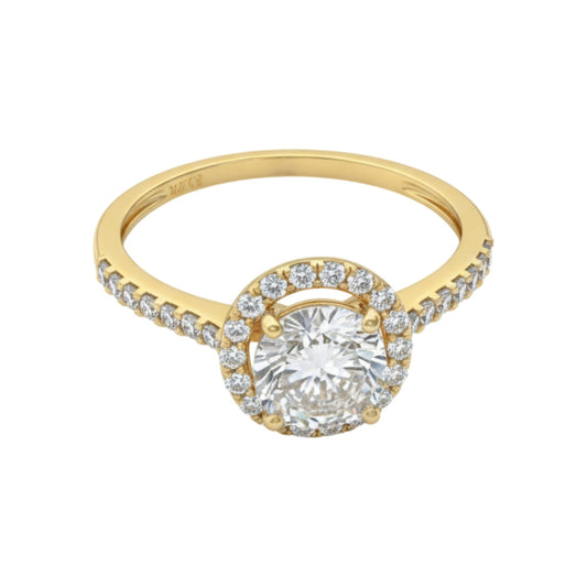 Gold ring with a large diamond and smaller diamonds on the band against a white background
