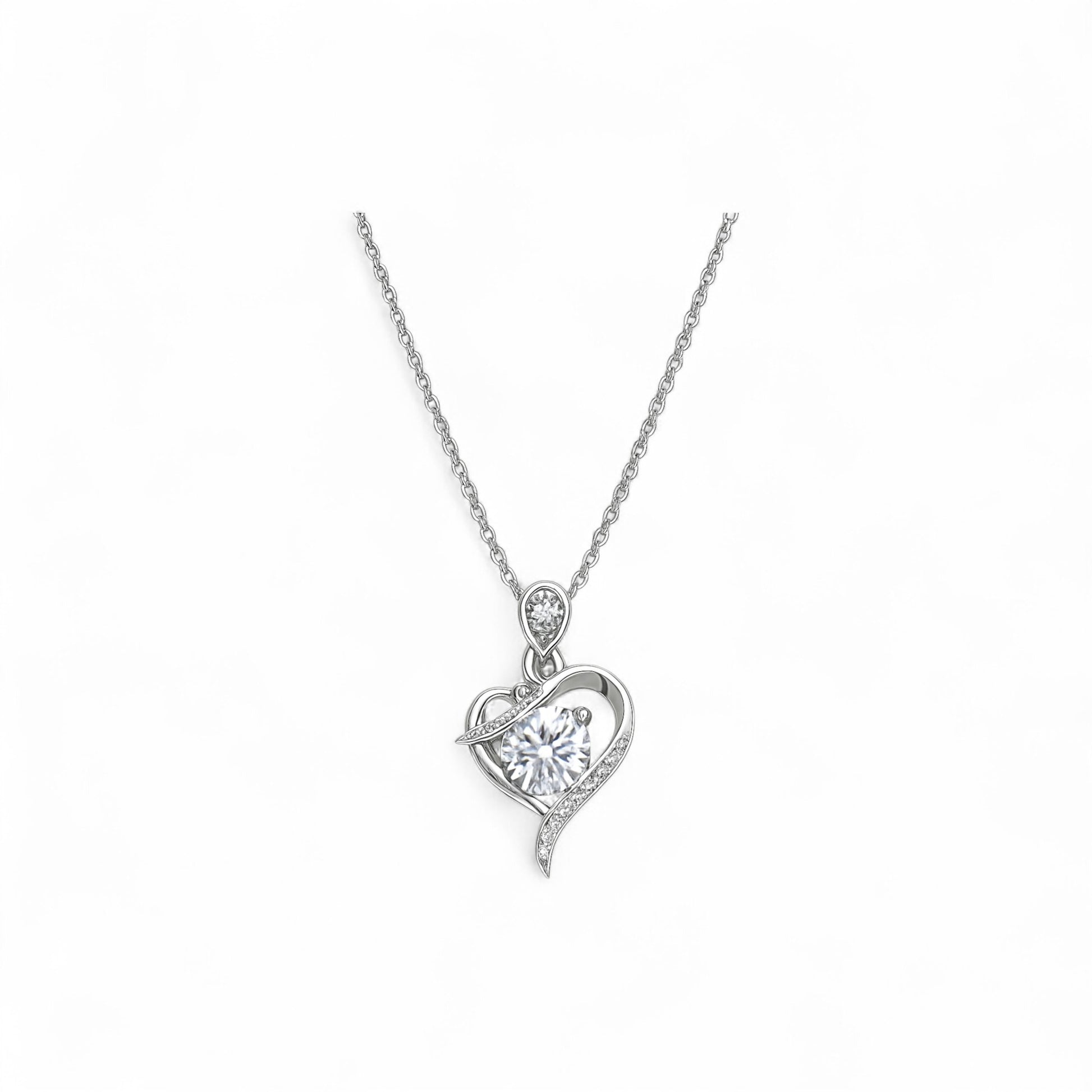 Silver heart-shaped pendant necklace on a white background