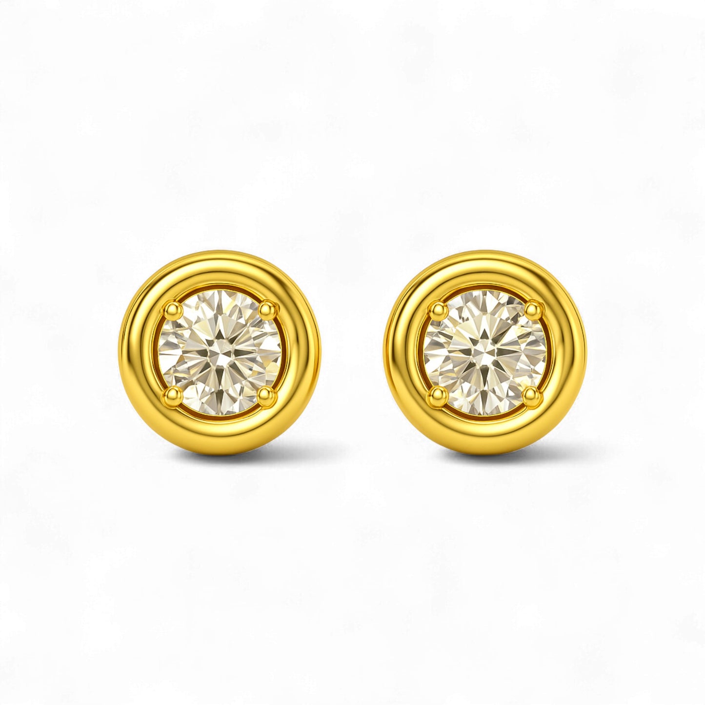 Gold earrings with round gemstones on a white background