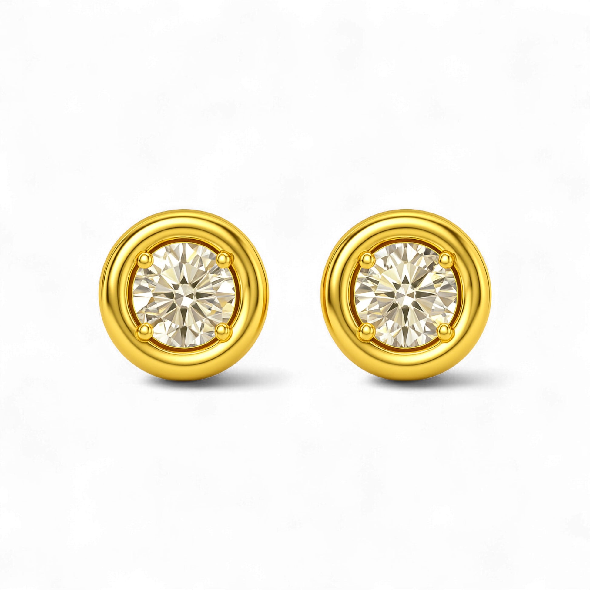 Gold earrings with round gemstones on a white background
