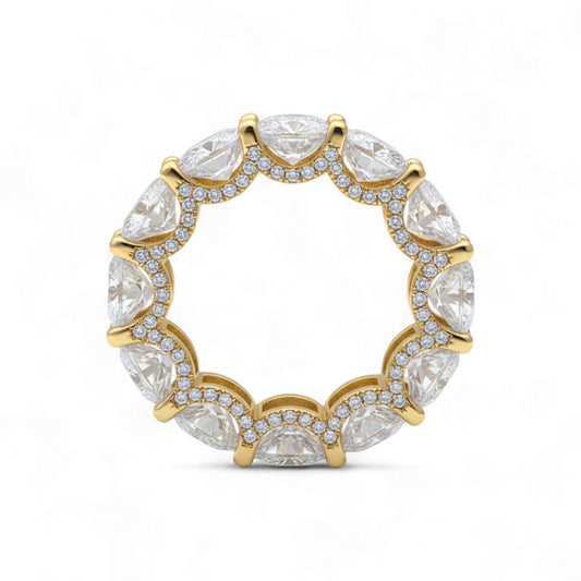 Gold ring with clear gemstones on a white background