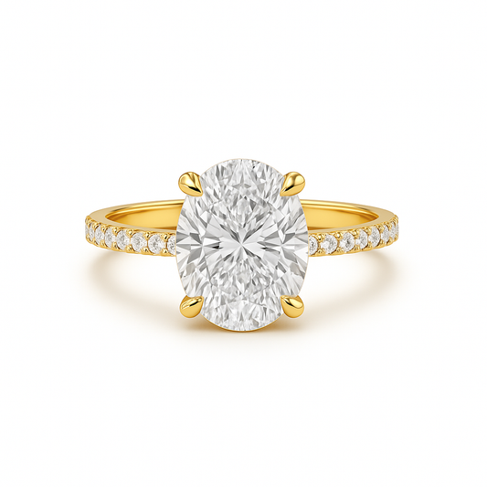 Gold ring with a large diamond and smaller diamonds on the band against a white background