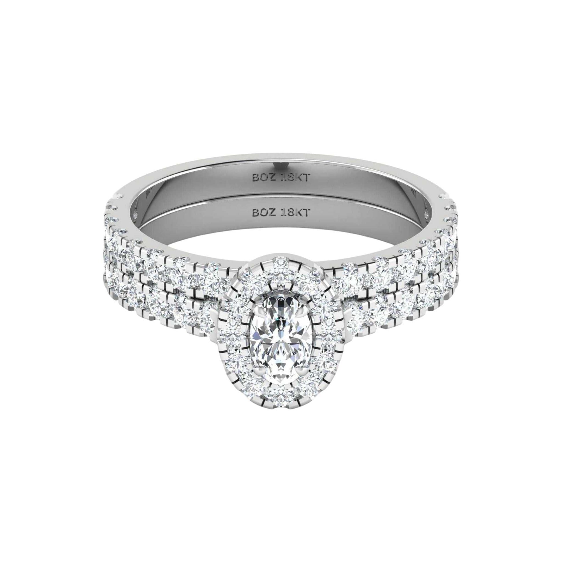 Diamond ring with 'BOZ' engraving on a white background