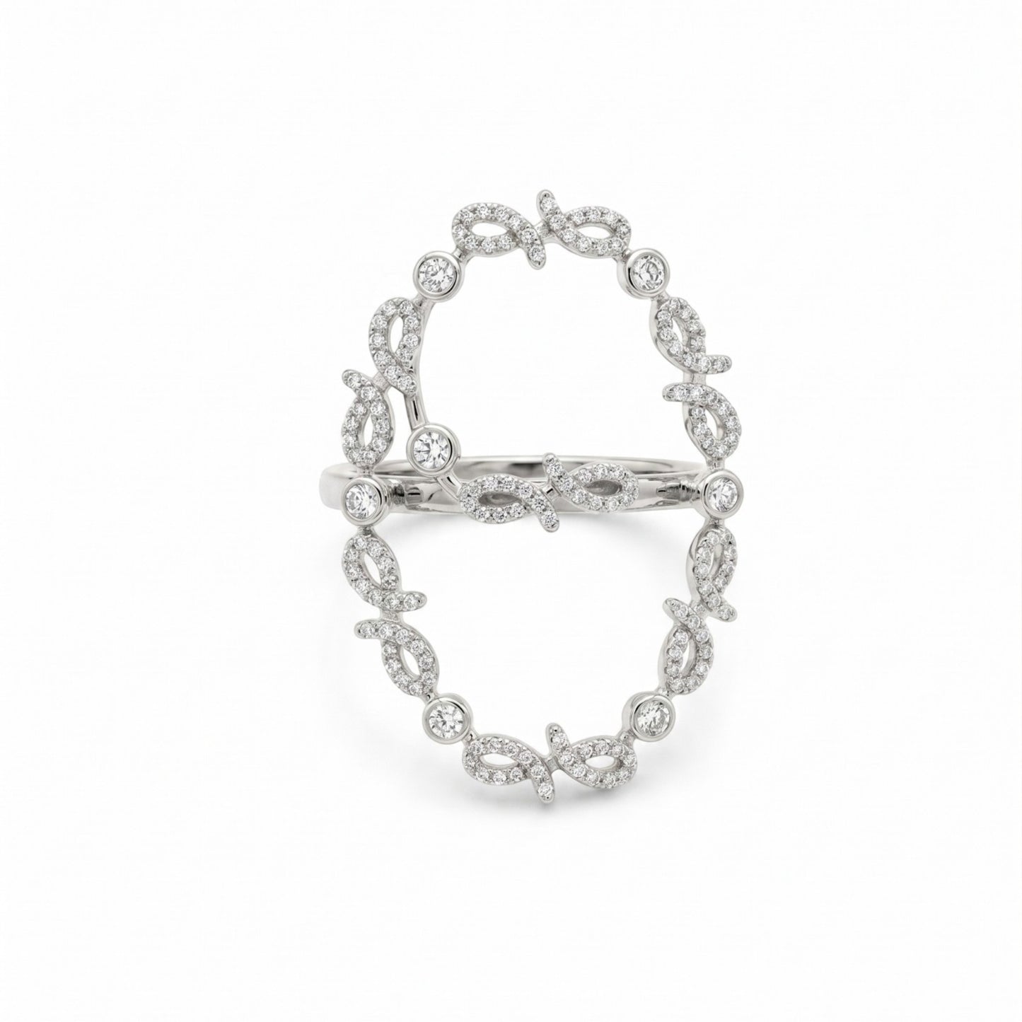 A silver-toned ring featuring an openwork oval design paved with small clear stones, displayed on a clean white background.