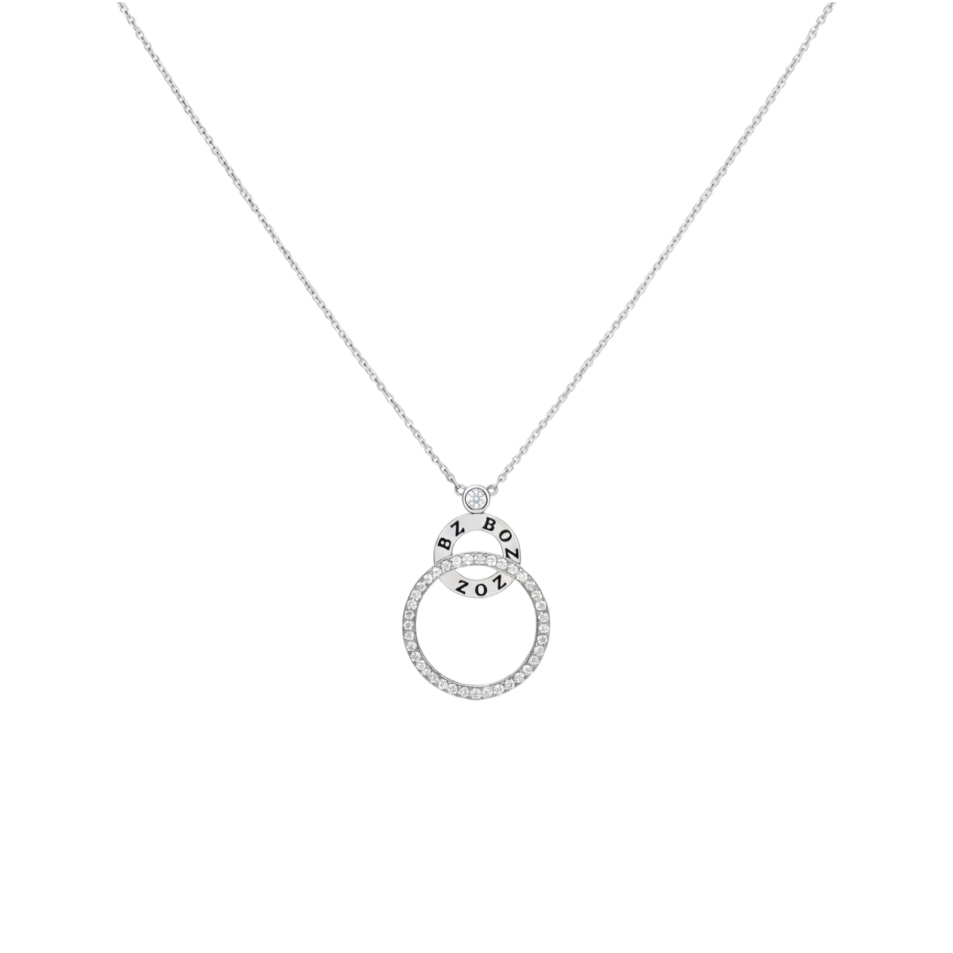 Silver necklace with a circular pendant on a white background