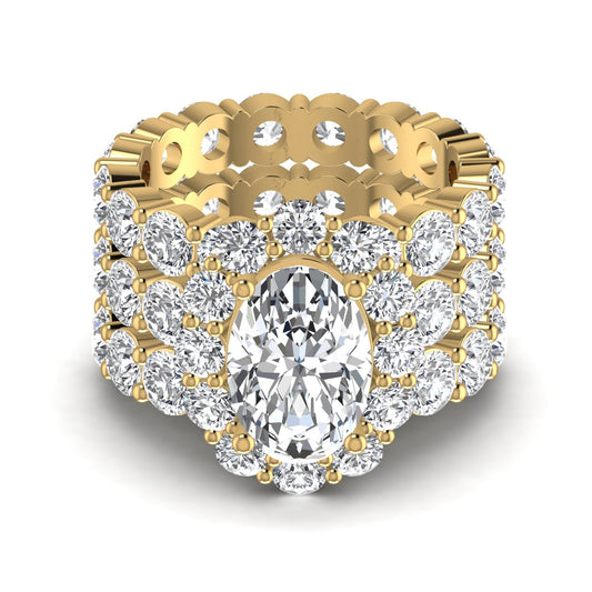 Gold ring with a large central diamond and smaller diamonds around on a white background